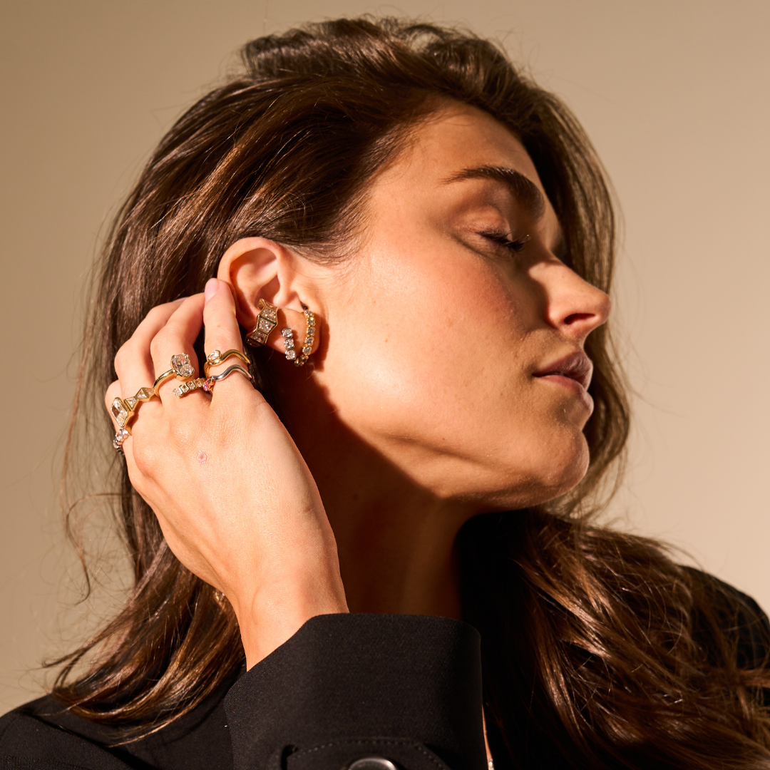 Model wearing the Deco Trapezoid Mega ear cuff with trapezoid-cut lab diamonds in 14K yellow gold.