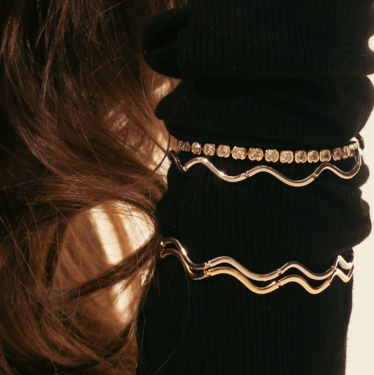 Gold hair ties with rhinestones on a black background