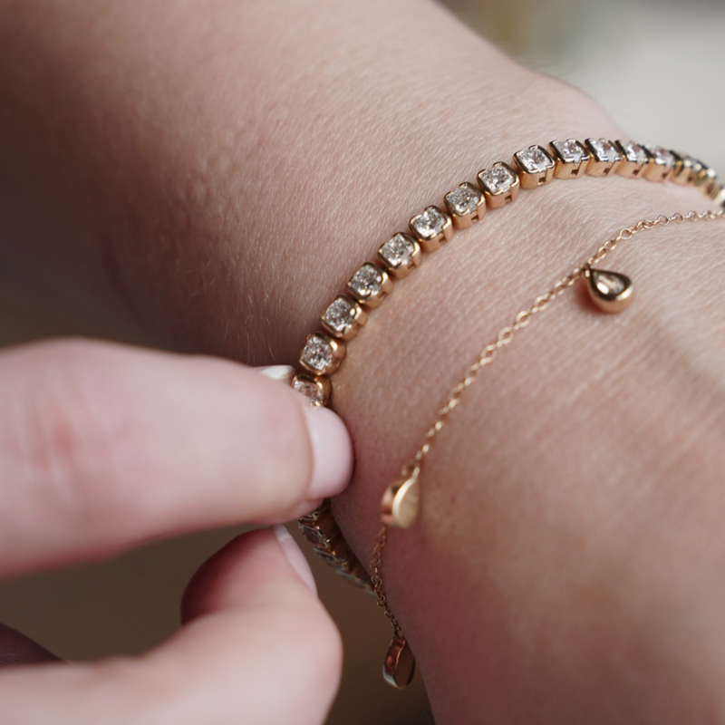 Model wears muse tennis bracelet with other sette styles