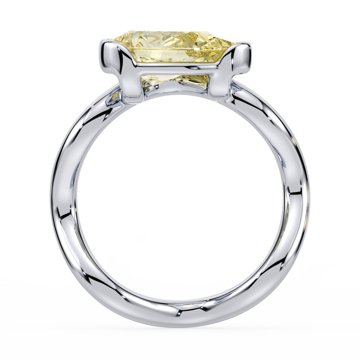 white gold ring with a yellow lab diamond on a white background