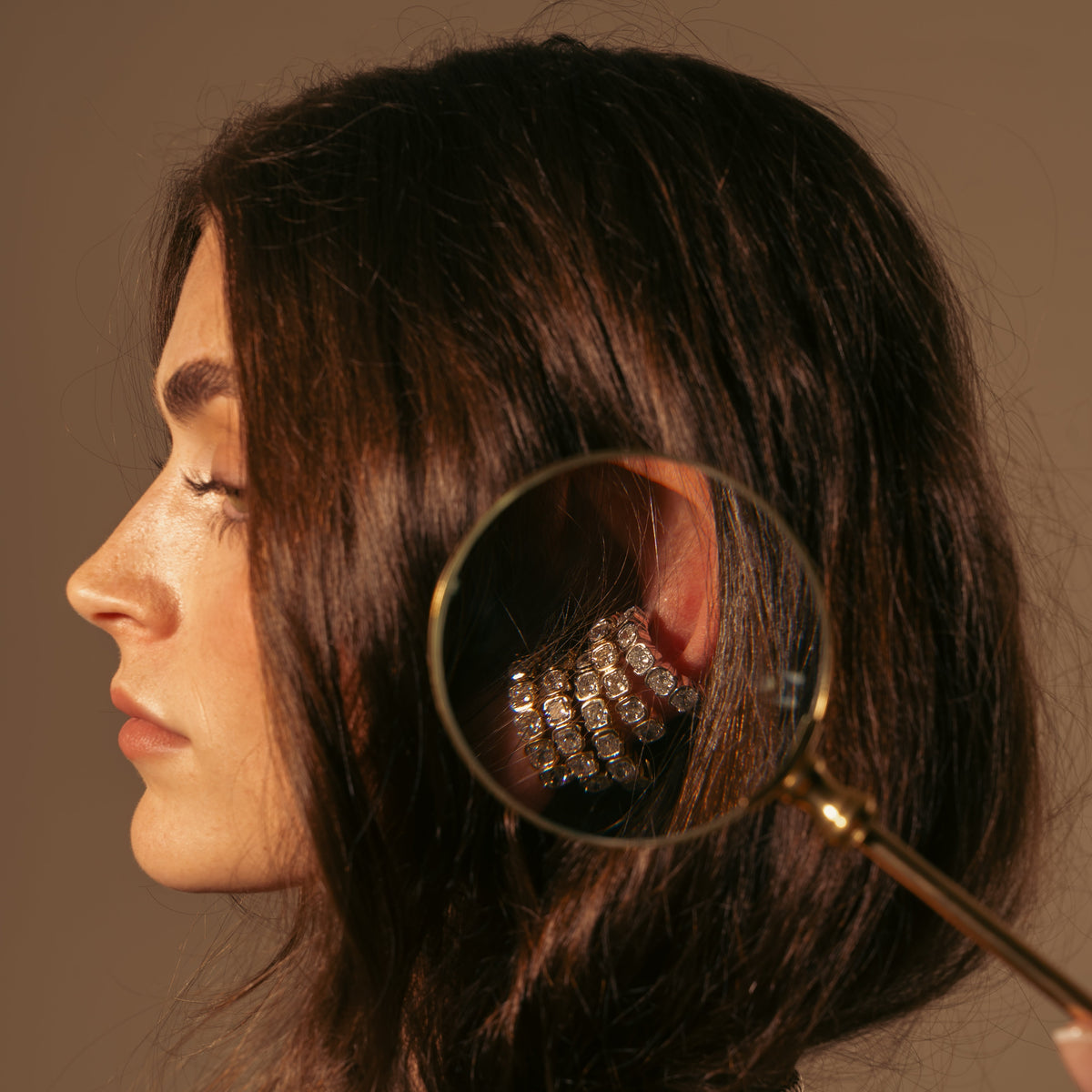 Model wearing the Muse Cascade lab diamond ear cuff in 14K yellow gold.