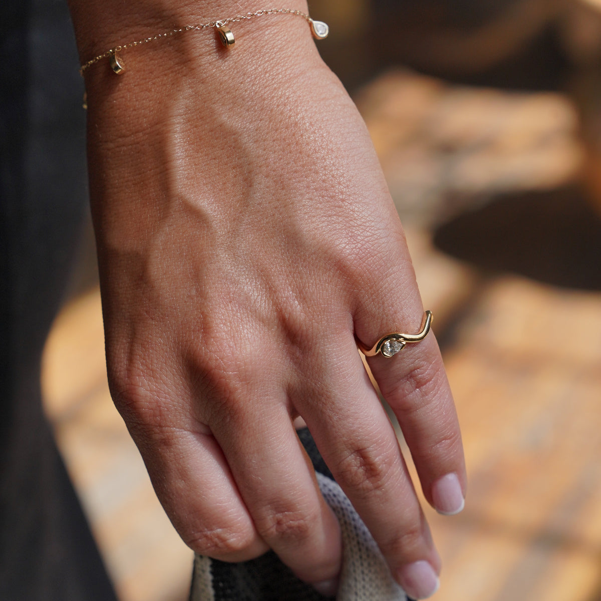 coquette pinky ring on model