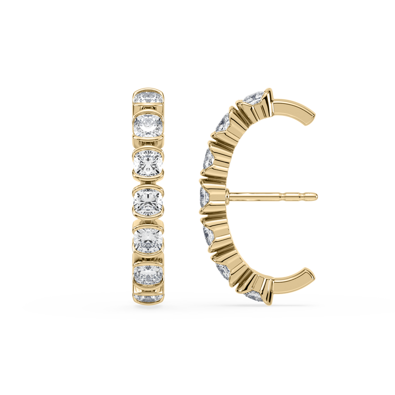 A pair of yellow gold stud earrings with a vertical row of cushion-cut clear gemstones, shown from the front and side on a plain white background.