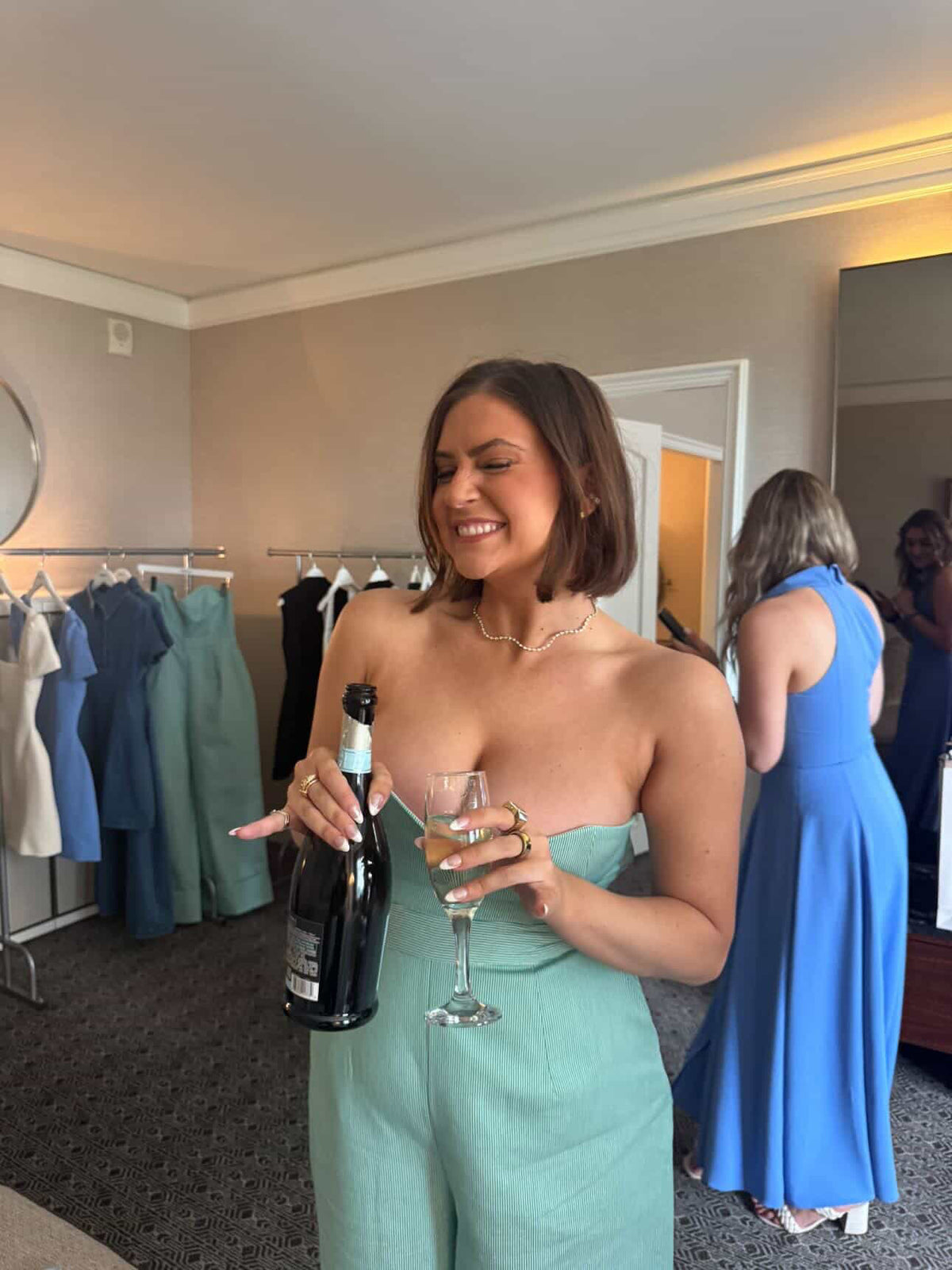 WOMAN WEARING A WAVE LAB DIAMOND NECKLACE AT AN EVENT