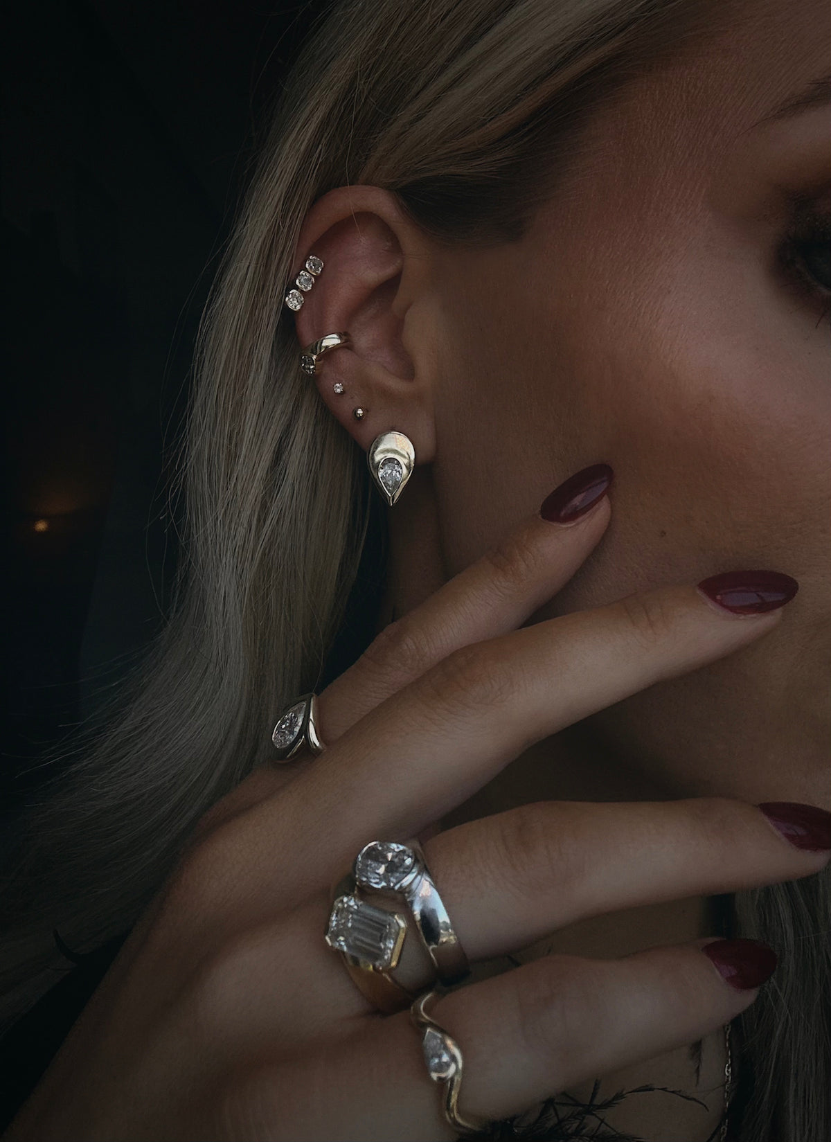 woman wearing multiple pieces of high end lab diamond jewelry