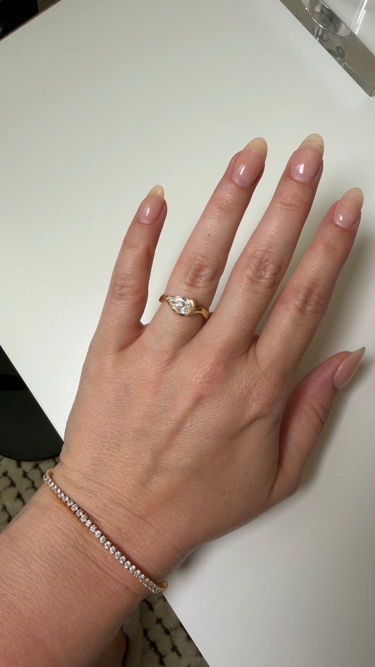 woman wearing her Coquette ring on her ring finger instead of her pinky ring