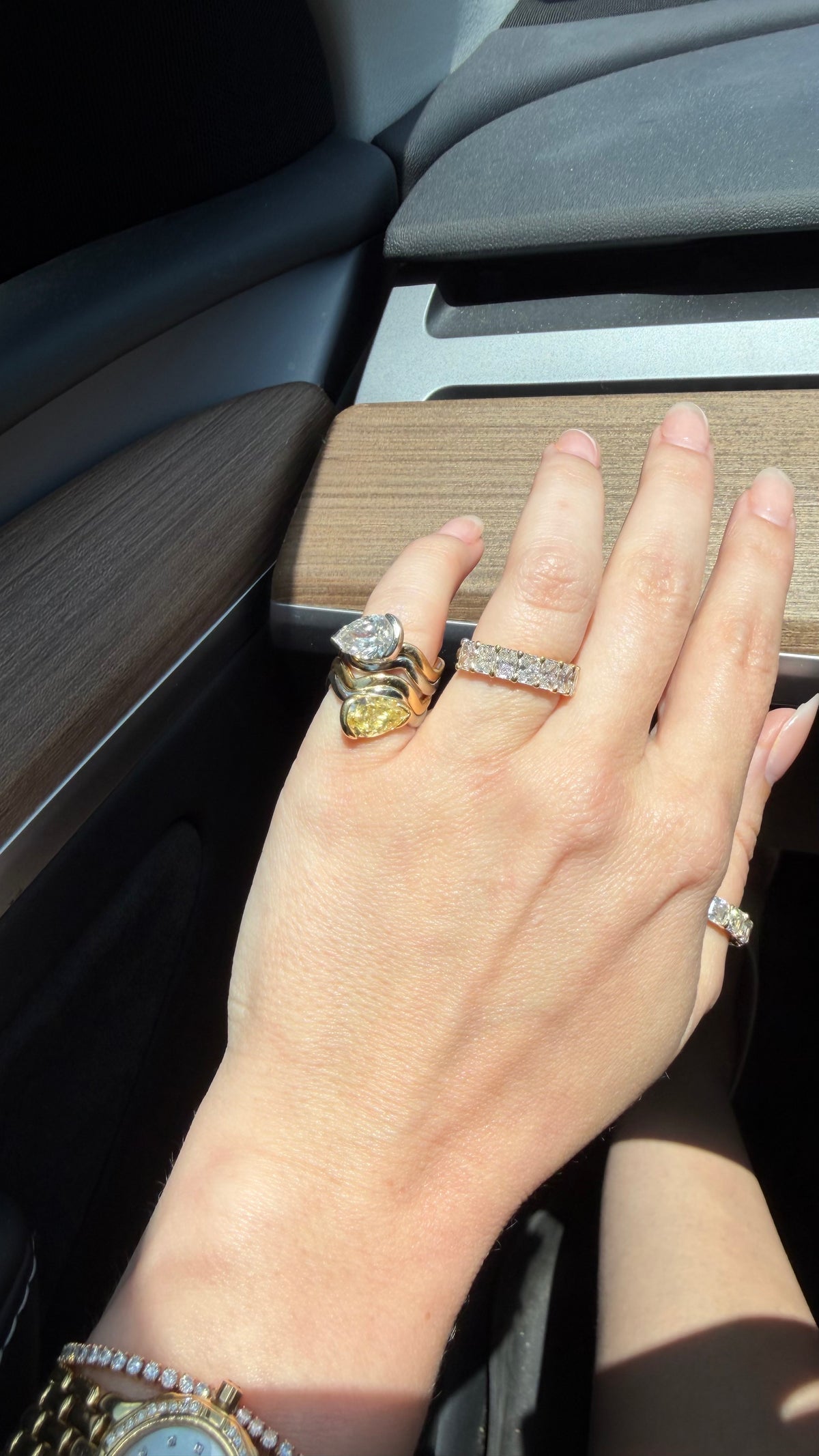 Coquette 2.o stacked on pinky in car