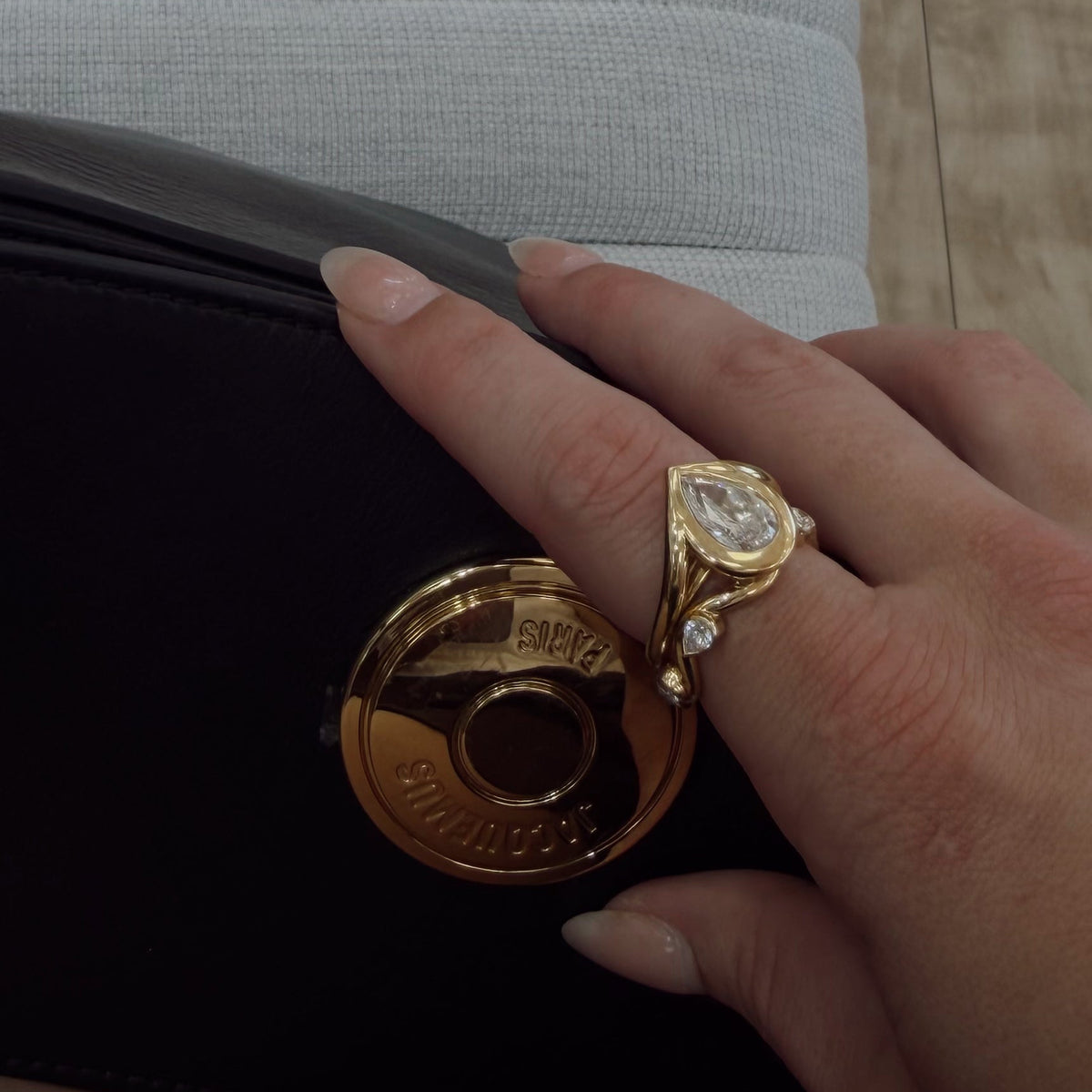Woman wearing pointer finger ring stacked with a band 