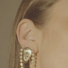 upclose video of woman's earrings