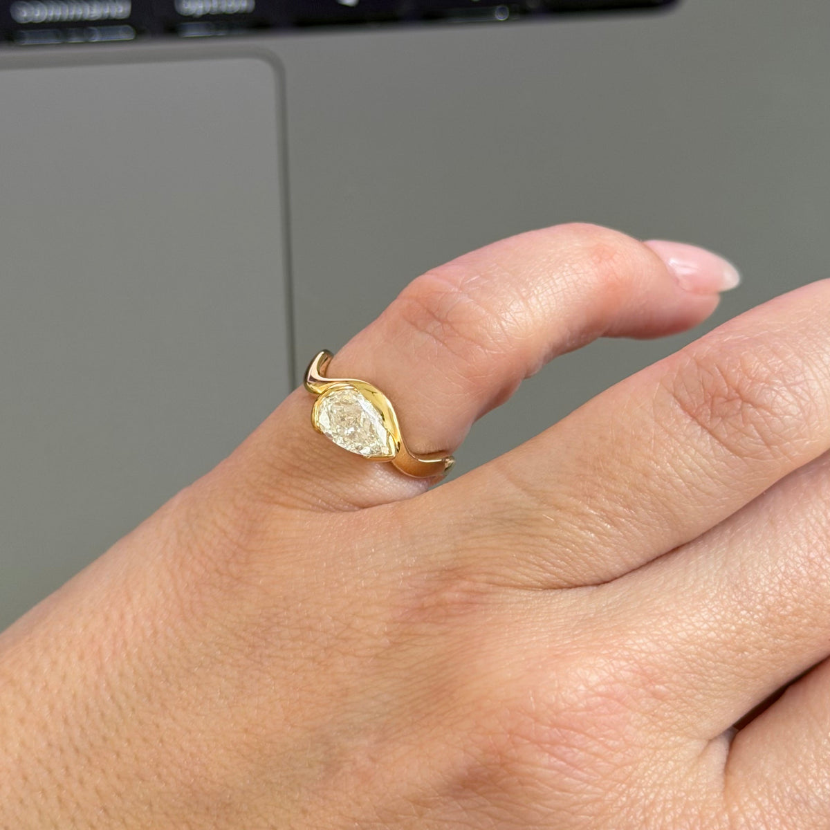 woman working while wearing her pinky ring 