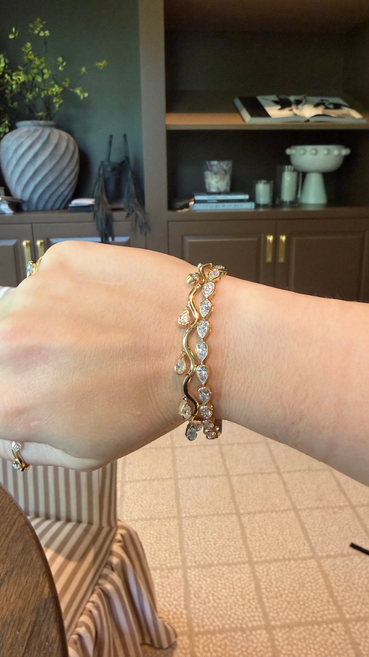woman wearing the coquette fringe and pear aura bracelet
