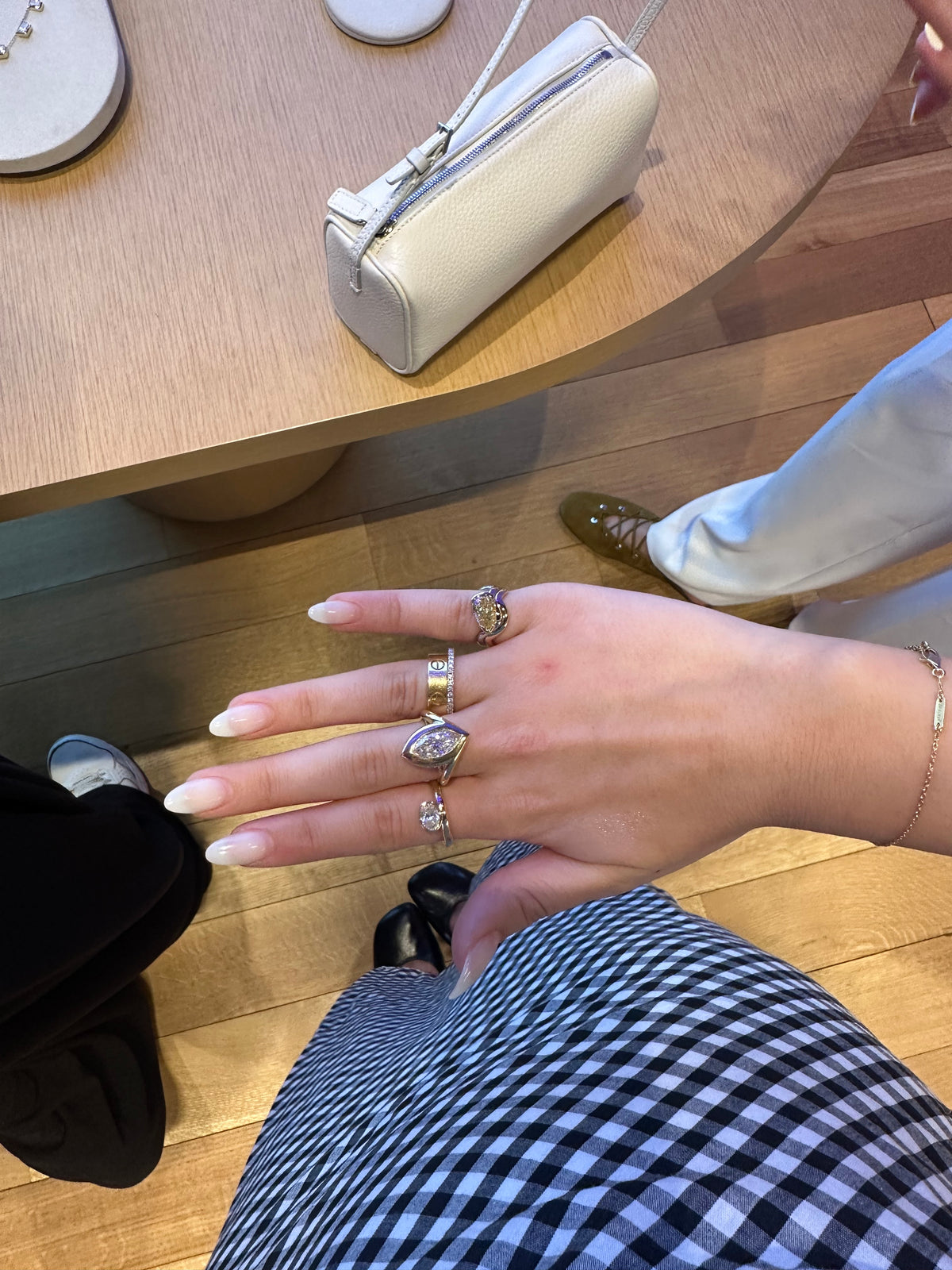 woman wearing a ring stack