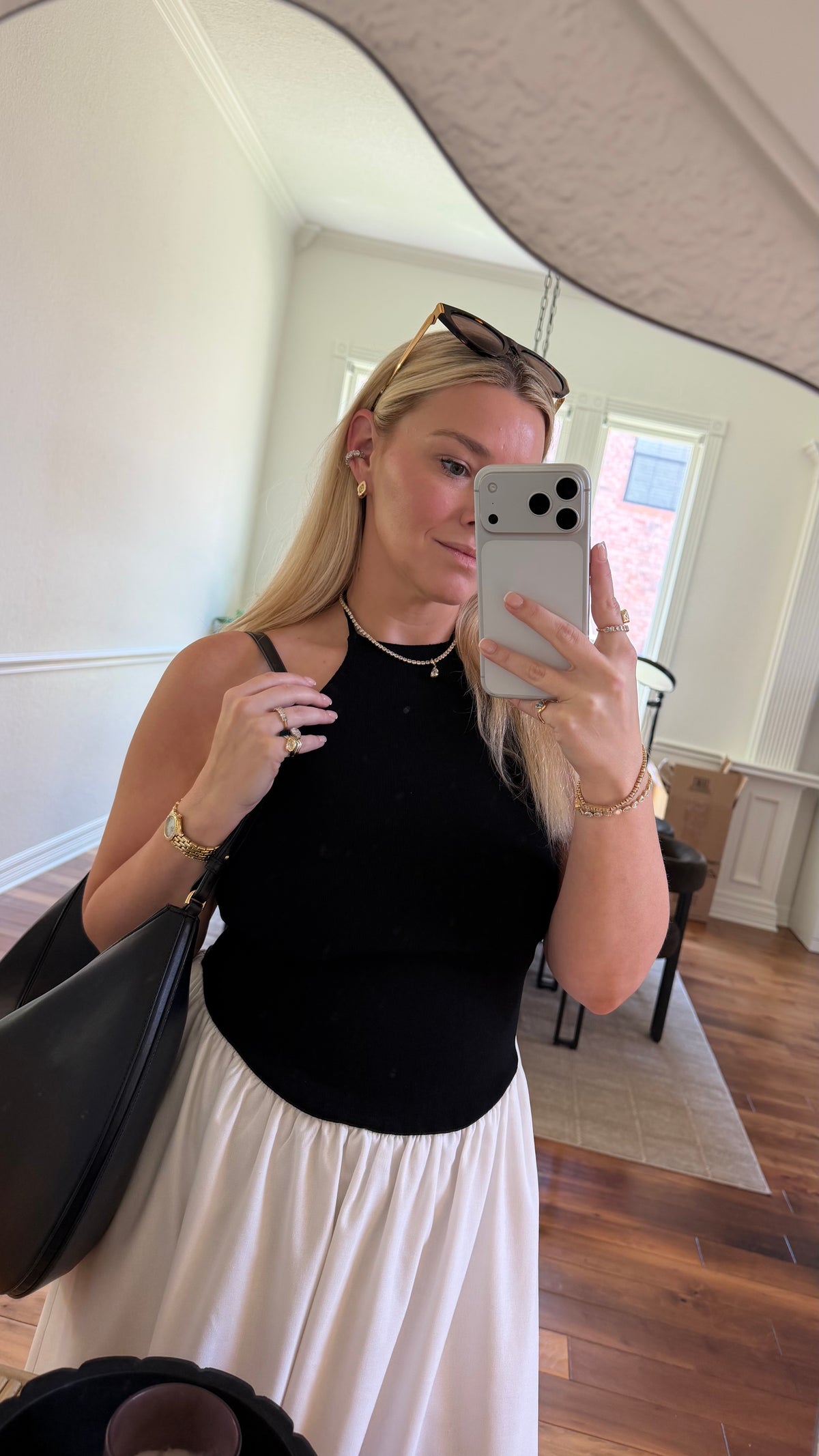 woman taking a photo of her outfit