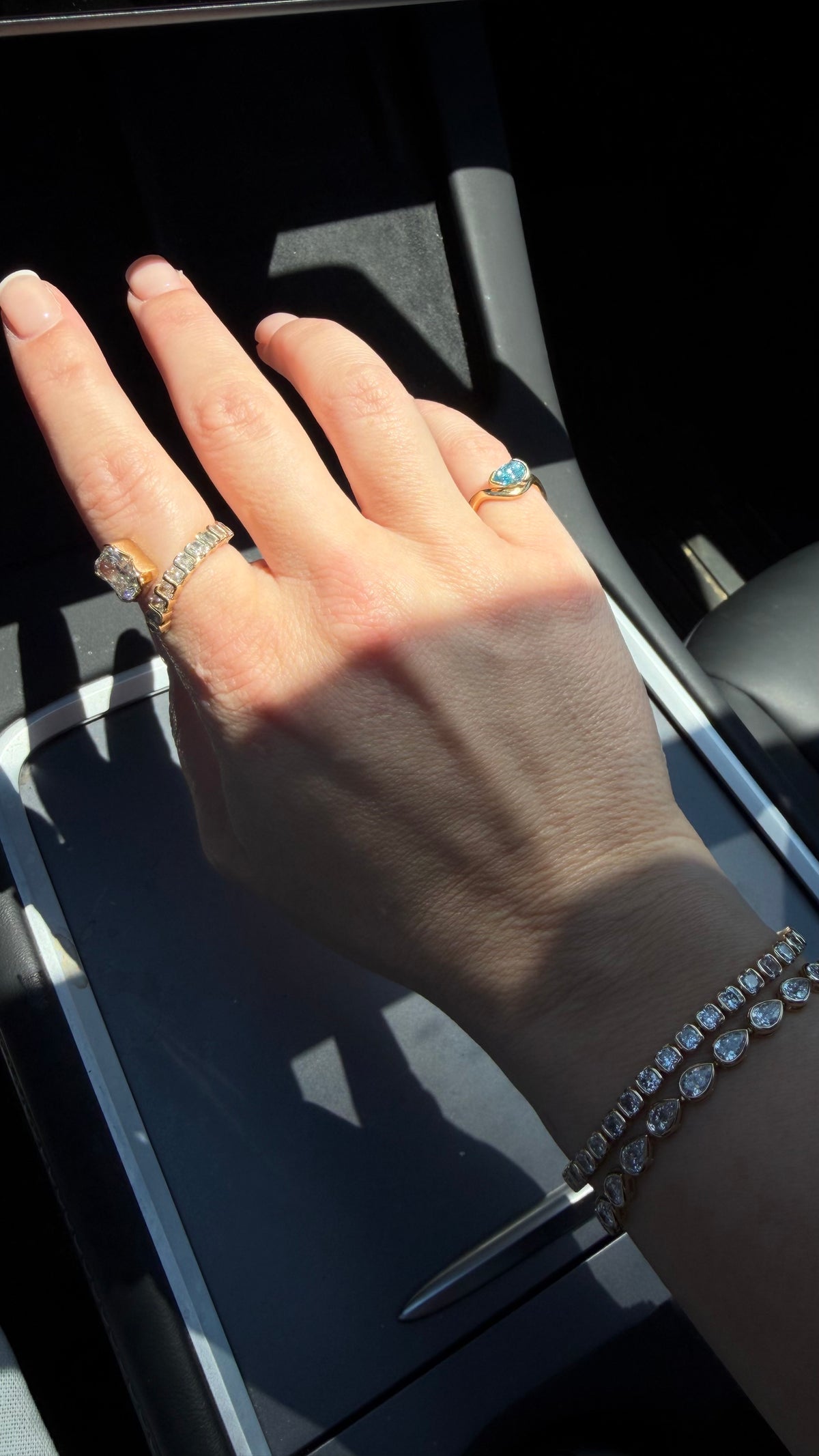 woman wearing jewelry in the car