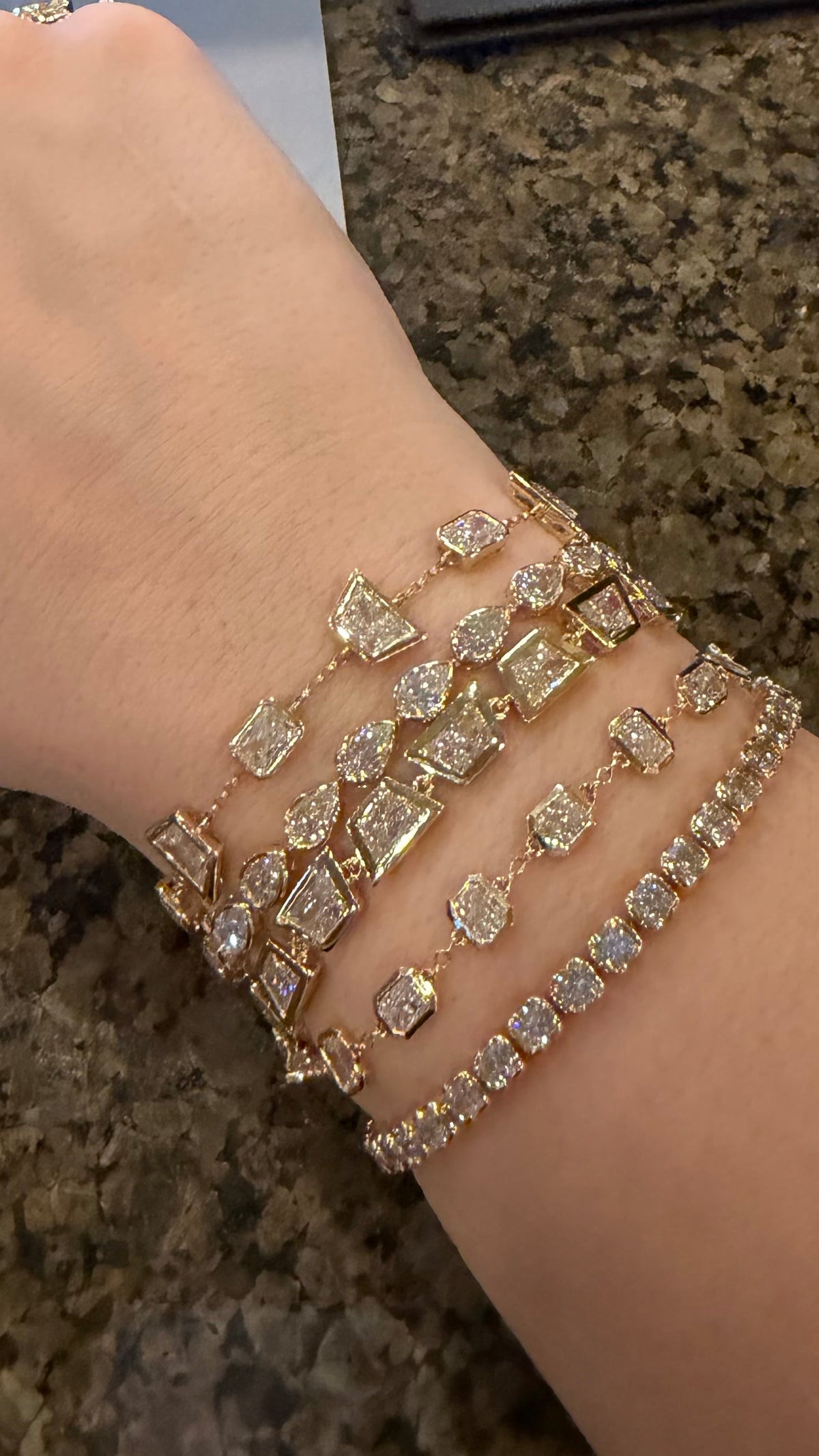woman wearing a stack of bracelets